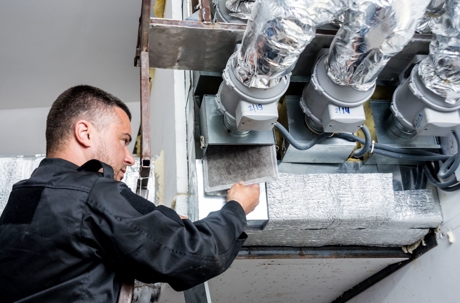 man working on industrial heater