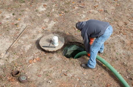 Man working on septic tank