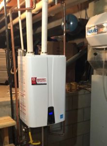 newly installed, modern tankless water heater in a residential basement