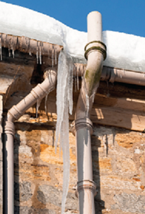 pipes and icicles on a building, pipes are frozen